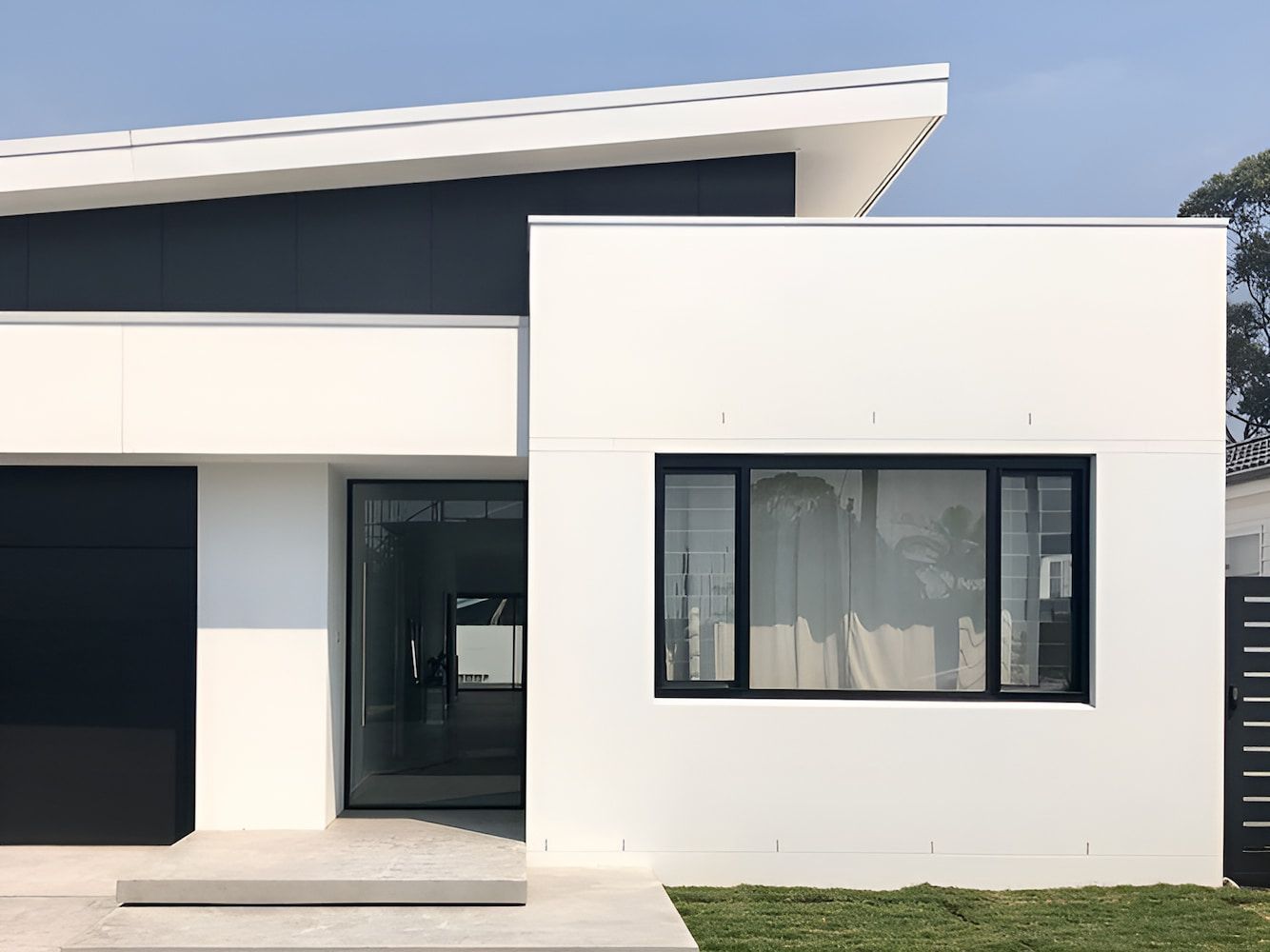 A White House With Black Trim And A Large Window — DeBu Studios In Southern Highlands, NSW