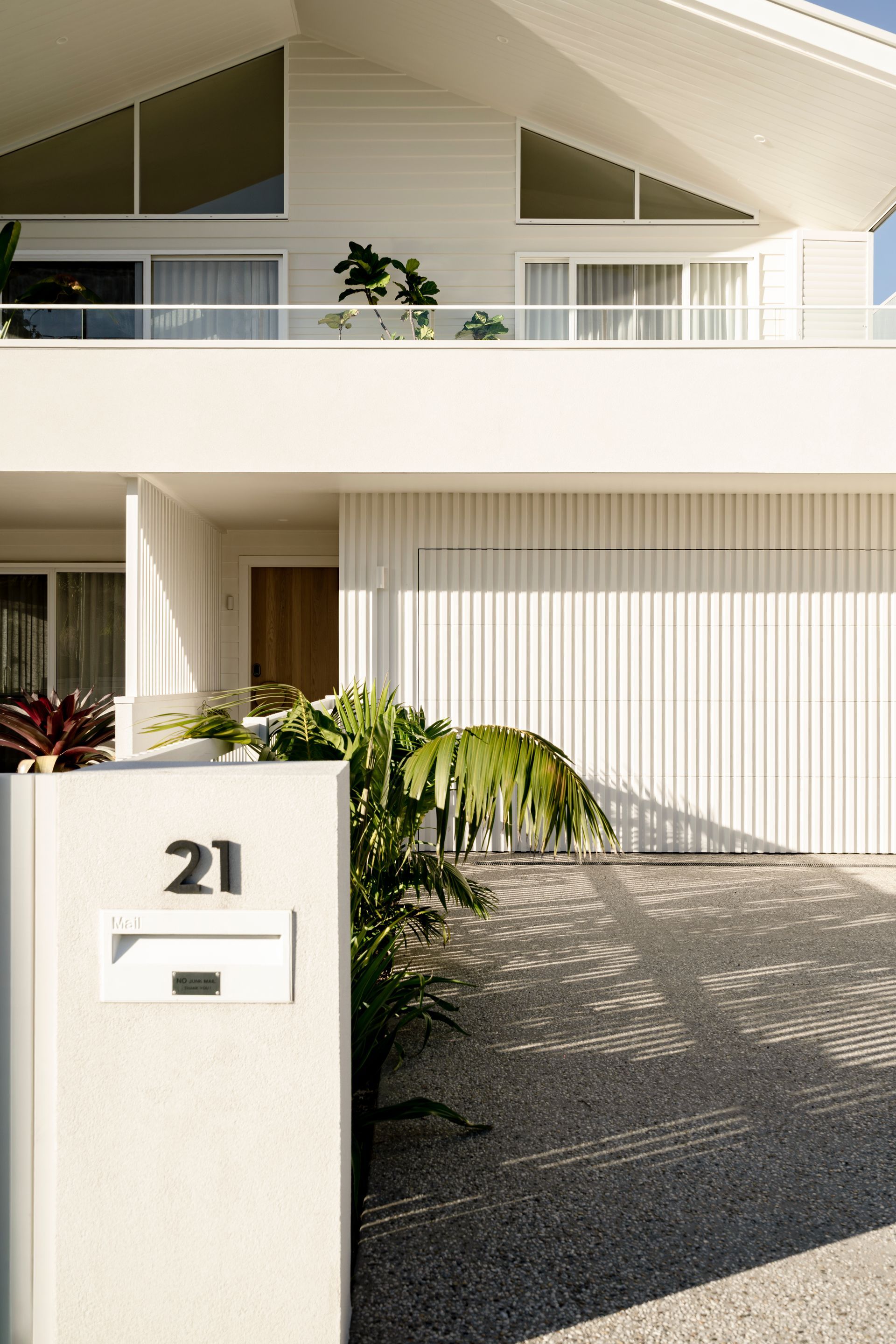 A white house with a white mailbox in front of i — DeBu Studios In Southern Sydney, NSW