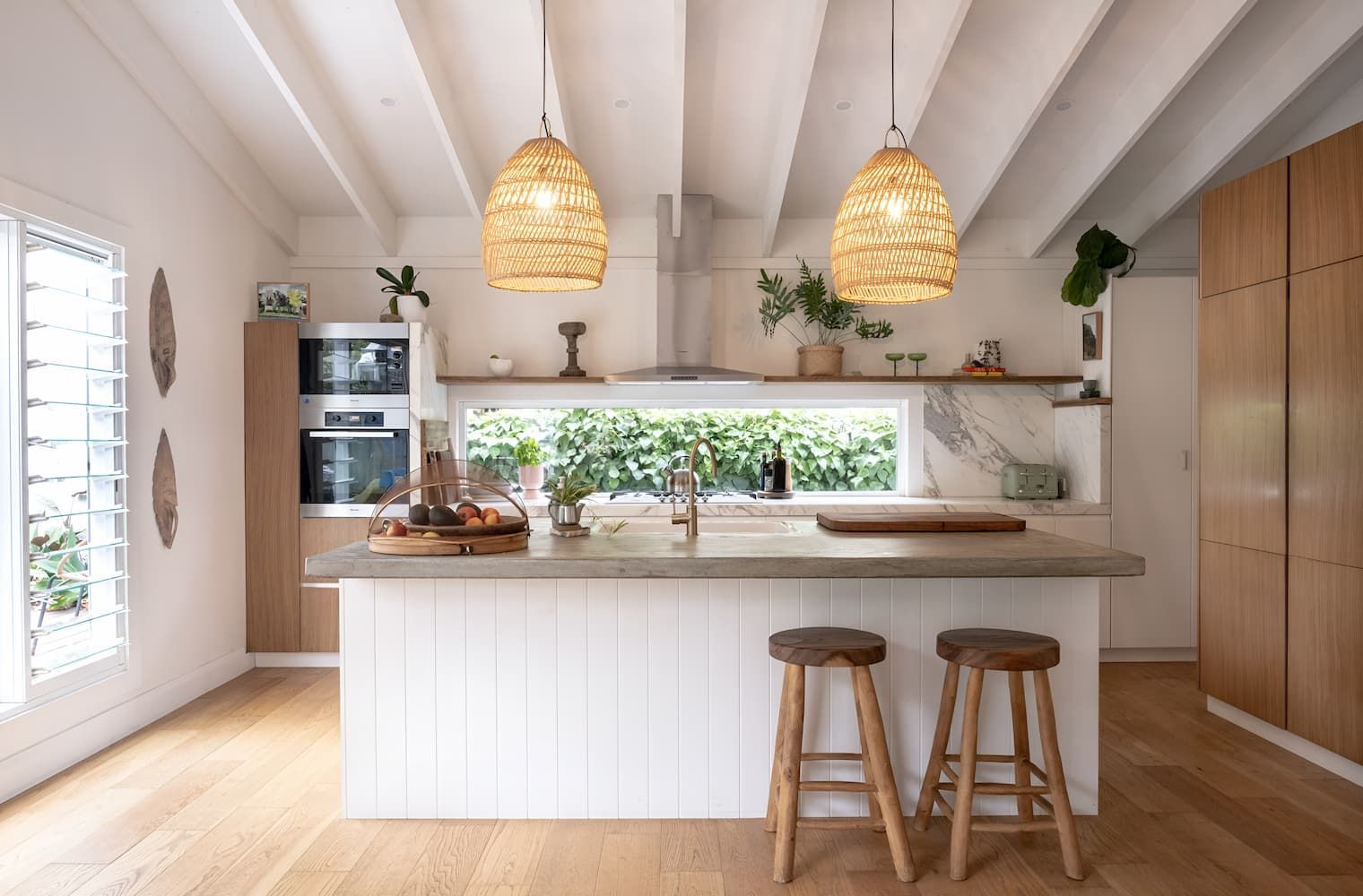 A Kitchen With A Large Island And Two Stools — DeBu Studios In Russell Vale, NSW