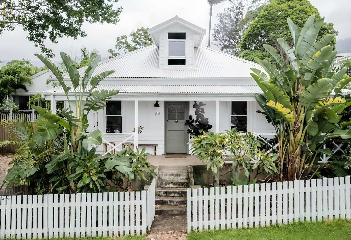 A White House With A White Picket Fence Around It — DeBu Studios In Russell Vale, NSW