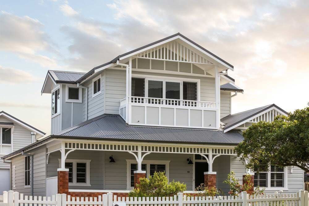 A Large White House With a Porch and a White Picket Fence — DeBu Studios In Russell Vale, NSW