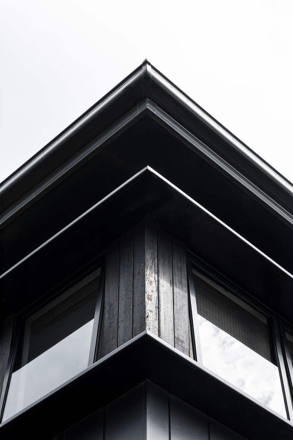 A Black and White Photo of the Corner of a Building — DeBu Studios In Russell Vale, NSW