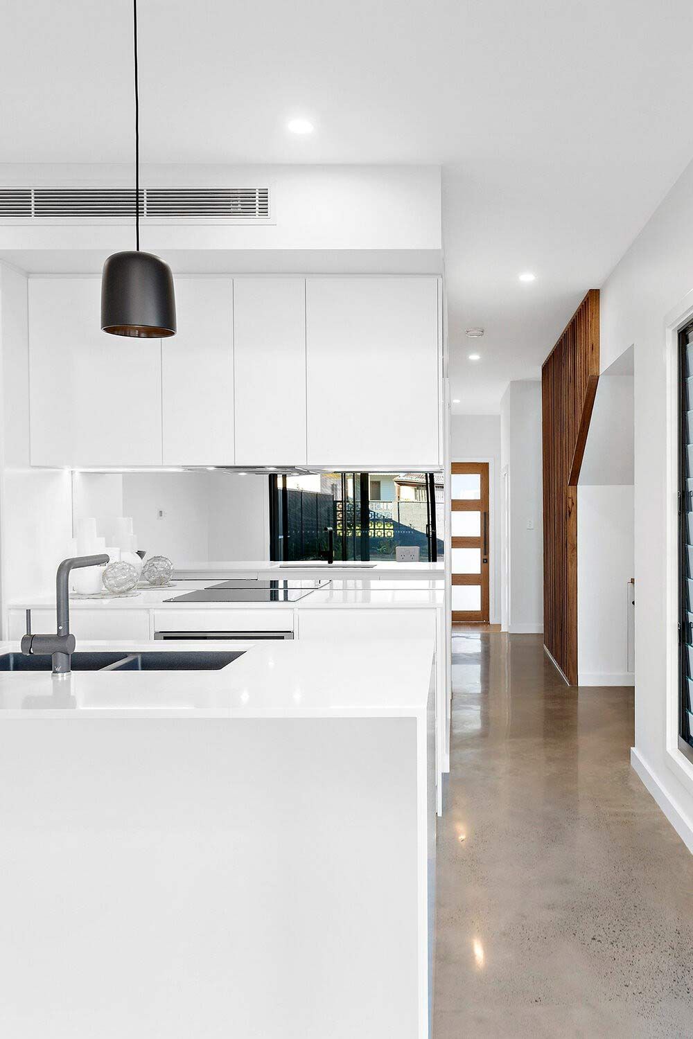 A Kitchen With White Cabinets — DeBu Studios In Russell Vale, NSW
