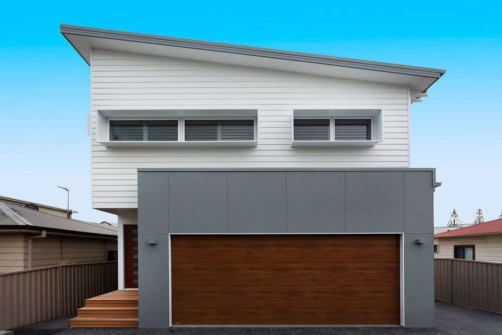 A White House With a Brown Garage Door — DeBu Studios In Russell Vale, NSW