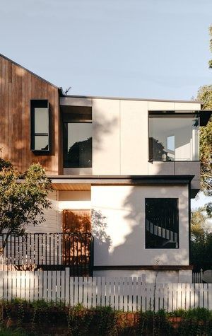 A Modern House With a Wooden Roof and a White Picket Fence — DeBu Studios In Russell Vale, NSW