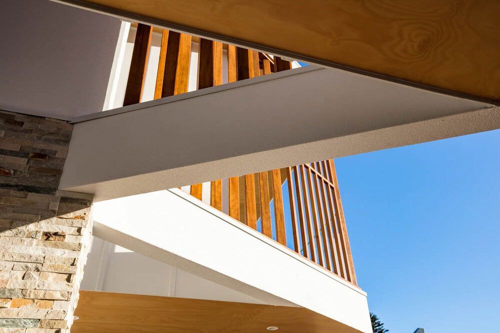 Looking Up at the Ceiling of a Building With a Wooden Railing — DeBu Studios In Russell Vale, NSW