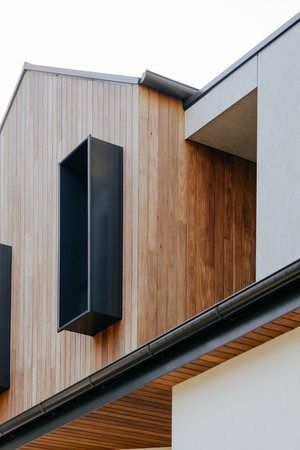 Close Up of a House With Wooden Siding and Black Windows — DeBu Studios In Russell Vale, NSW