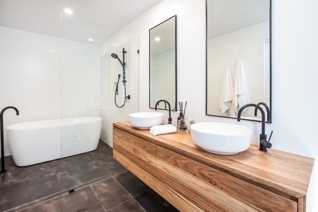 A Bathroom With Two Sinks and a Bathtub — DeBu Studios In Russell Vale, NSW