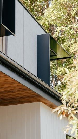 A Close Up of the Side of a Building With Trees in the Background — DeBu Studios In Russell Vale, NSW