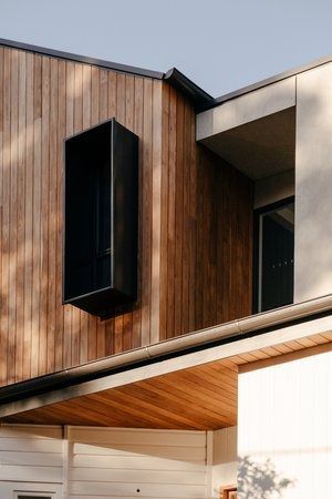 A House With a Wooden Facade and a Black Window — DeBu Studios In Russell Vale, NSW