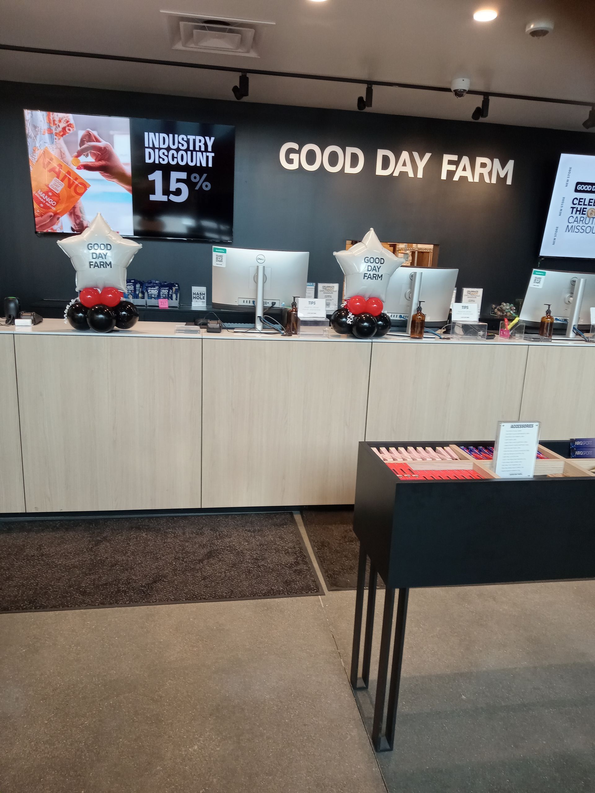 A counter in a store with a sign that says good day farm
