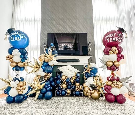 A living room filled with balloons and a fireplace.