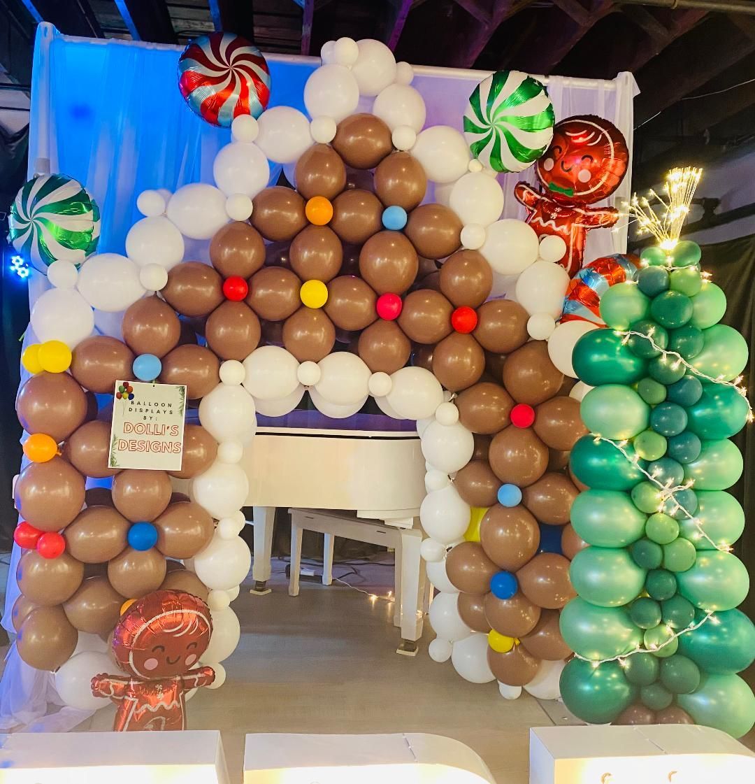 A gingerbread house made of balloons and candy