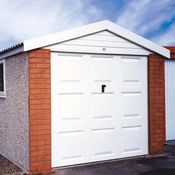 White garage with brick fronts
