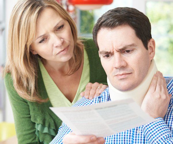 Couple Reading Letter — Bozeman, MT — Buckley Law Office