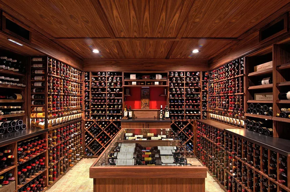 A large wine cellar filled with lots of wine bottles.