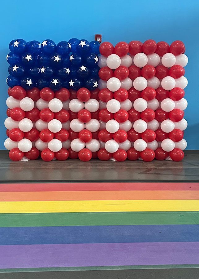 An american flag made of red white and blue balloons