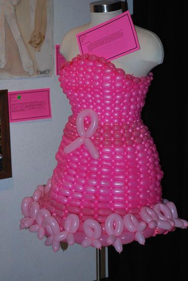 A pink balloon dress with a pink ribbon on it