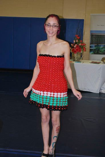 A woman is wearing a red and green balloon dress