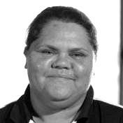 A black and white photo of a woman 's face.