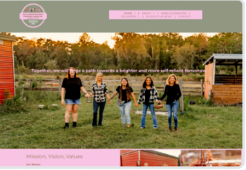 A group of women are standing in a field holding hands.