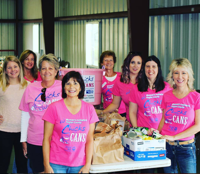 A group of women wearing pink shirts that say quicks cans