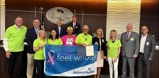 A group of people standing next to each other holding a flag that says i feel weird.