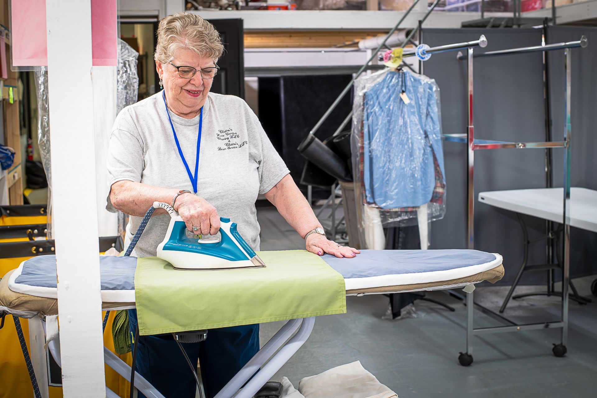 Claire's employee ironing linens