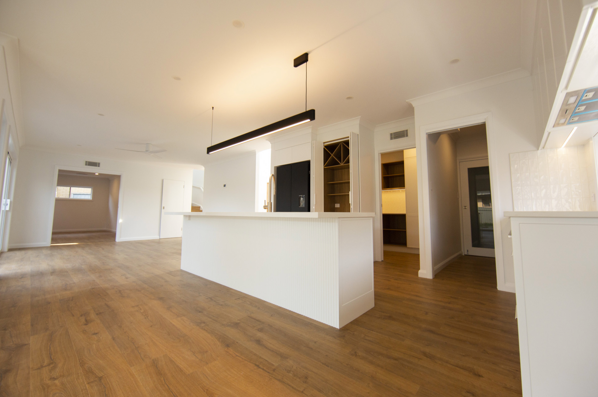 A Group Of Construction Workers Are Working On A Construction Site — Beach Breeze Building In Tumbi Umbi, NSW