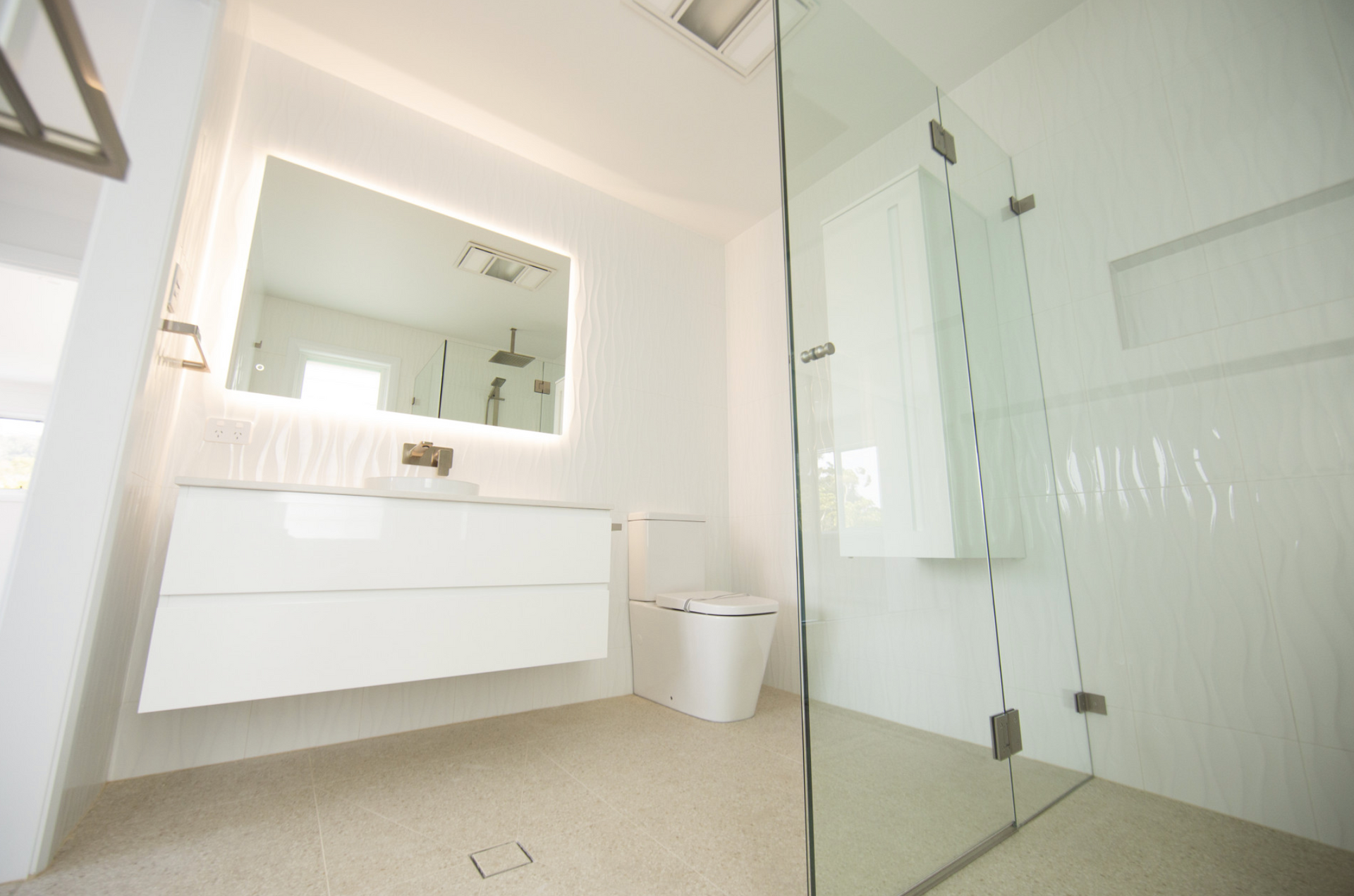 A White Bathroom — Beach Breeze Building In Tumbi Umbi, NSW