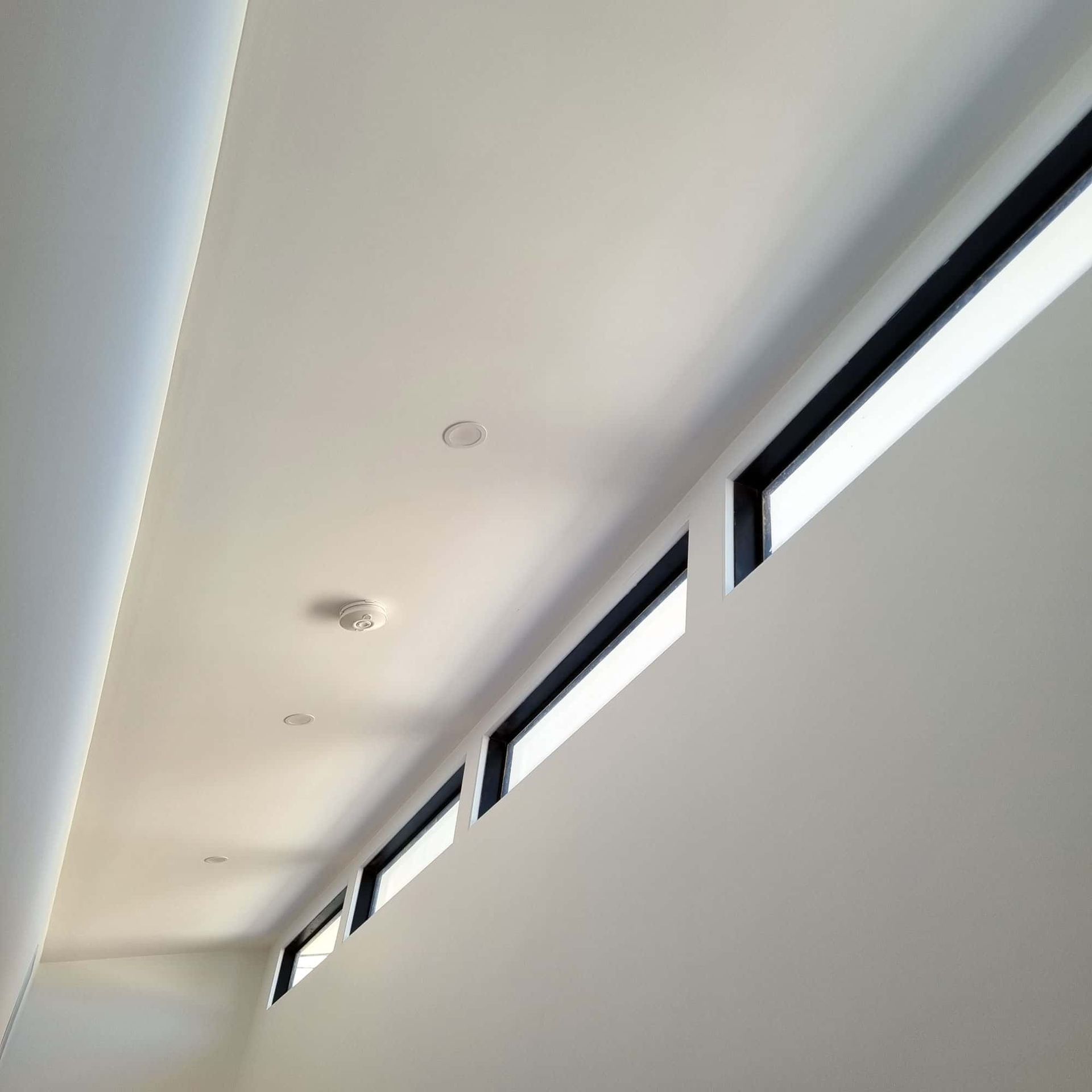 A Ceiling With A Row Of Windows On It β Beach Breeze Building In Tumbi Umbi, NSW