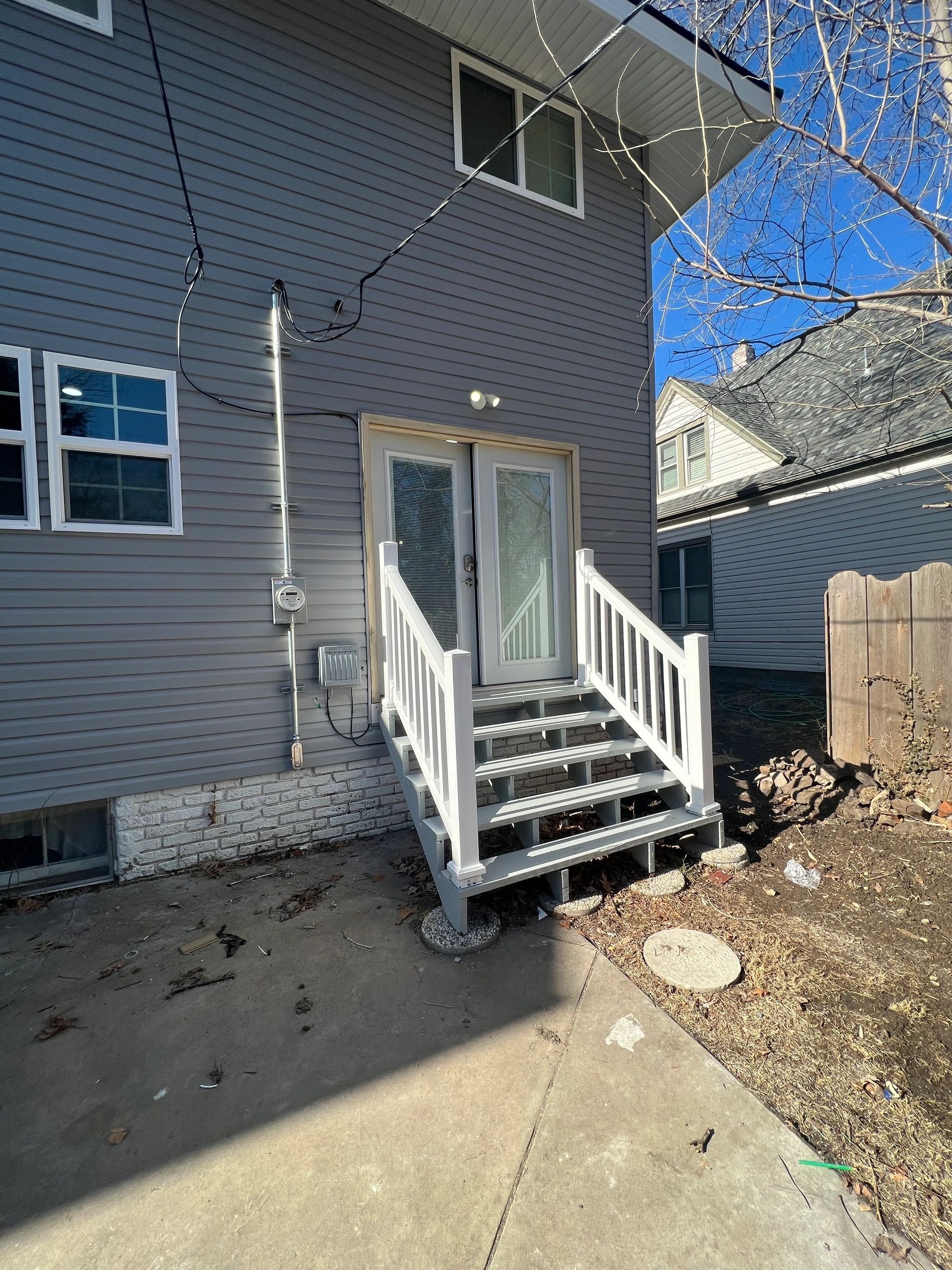 A house with stairs leading up to the front door