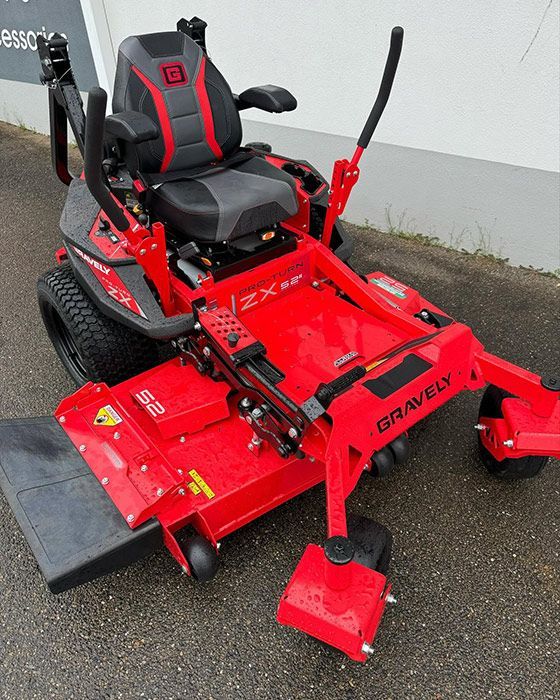 A Red Gravely Lawn Mower Is Parked On The Side Of The Road — Ken Matthews Auto & Mower Centre In Ulladulla, NSW