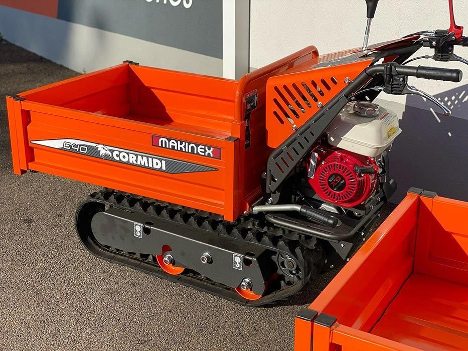 A Small Orange Dump Truck With A Motor Is Parked On The Side Of The Road — Ken Matthews Auto & Mower Centre In Ulladulla, NSW