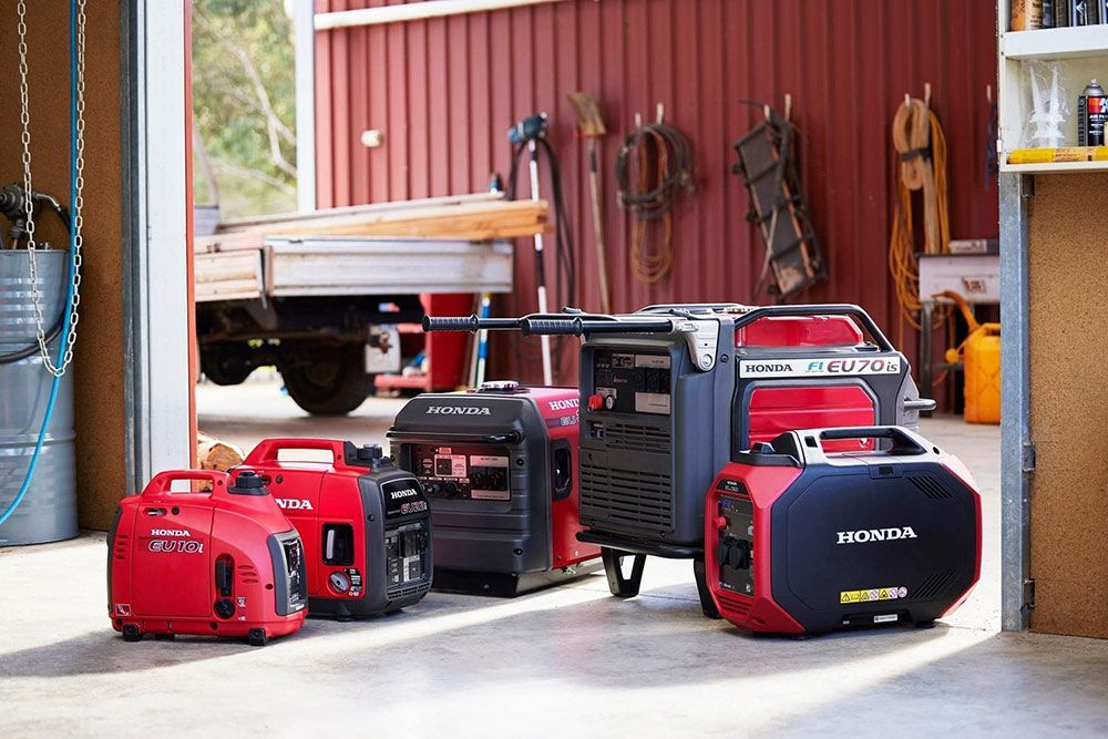 A Group Of Generators Are Lined Up In A Garage — Ken Matthews Auto & Mower Centre In Ulladulla, NSW