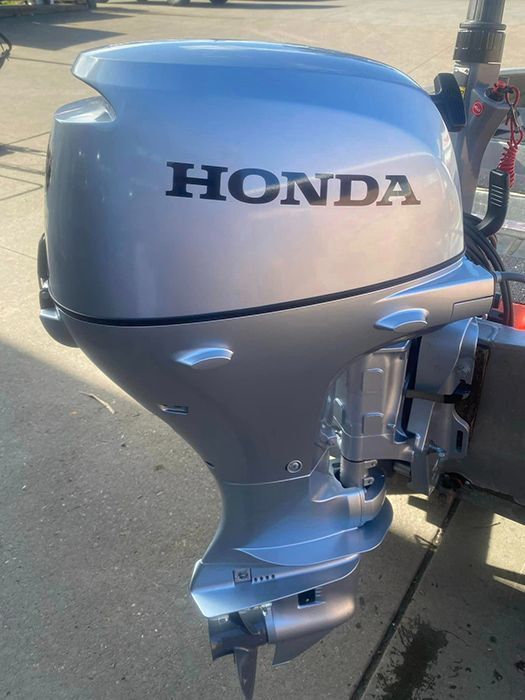 A Honda Outboard Motor Is Parked On The Side Of The Road — Ken Matthews Auto & Mower Centre In Ulladulla, NSW