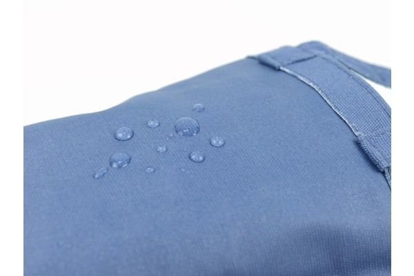 A close up of a blue cloth with water drops on it