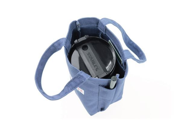 A blue tote bag with a headphone in it