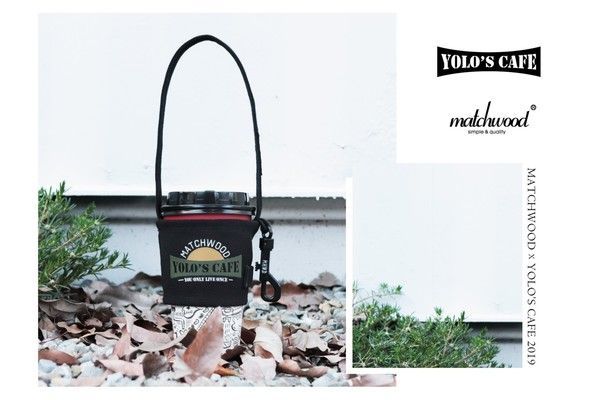 A black cup holder with the word yolo 's cafe on it