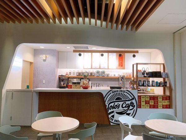 Tables and chairs in front of a table 's cafe counter
