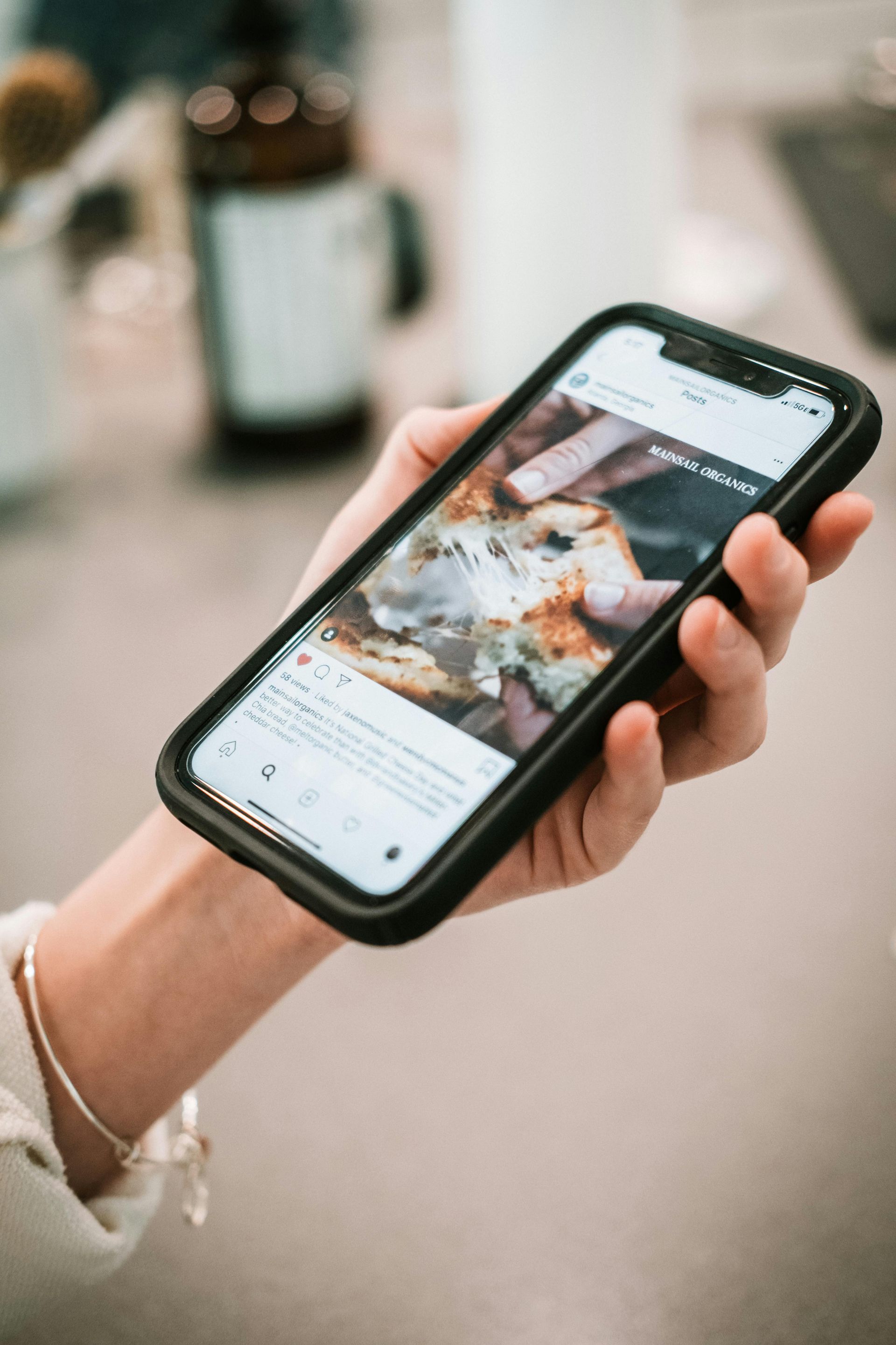 A person is holding a cell phone in their hand.