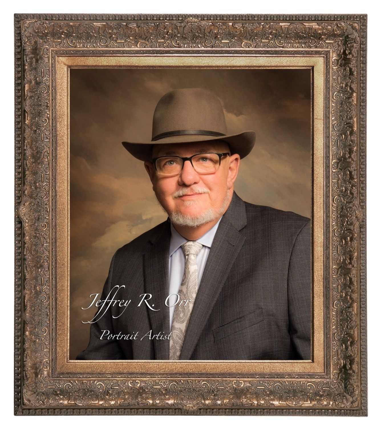 A distinguished older man wearing a hat and suit, framed portrait.