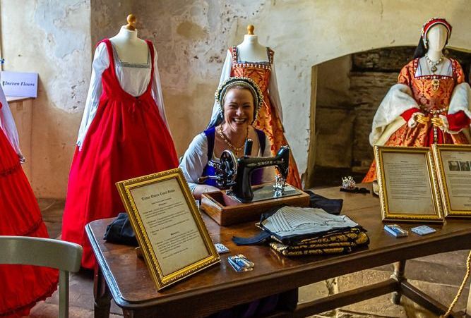 Tudor woman using a sewing machine.