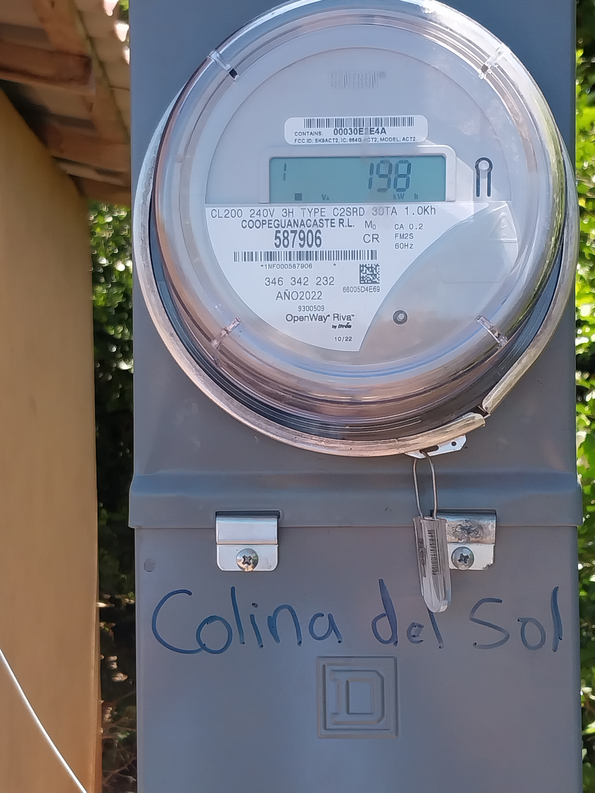 Electric meter box with a digital display reading 158. 