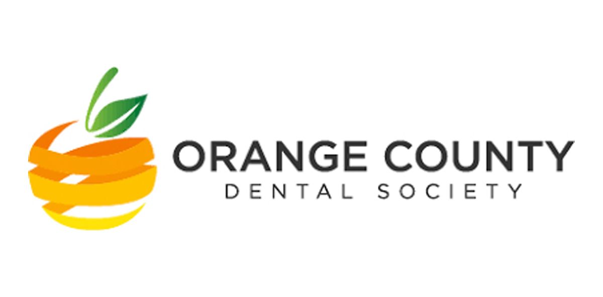 The orange county dental society logo is a colorful apple with leaves on it.