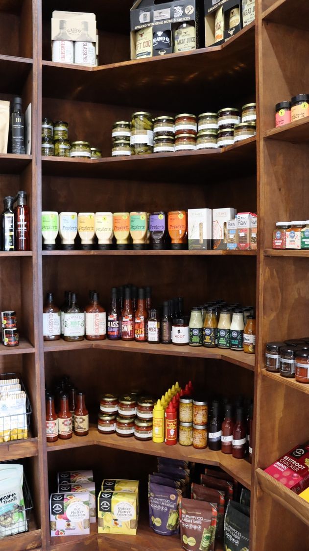 A corner of a store filled with lots of food and condiments.
