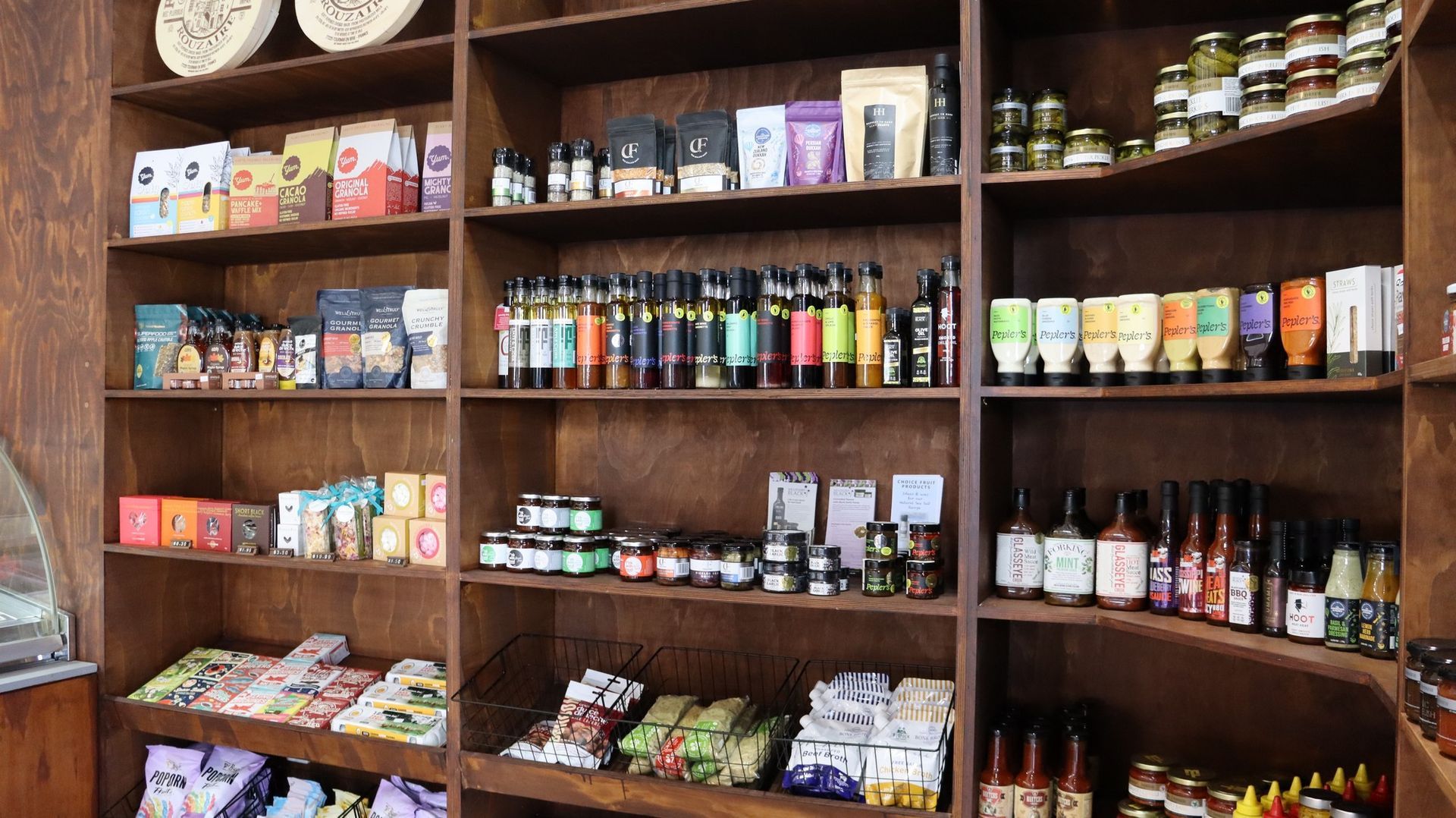 A store filled with lots of food and drinks on shelves.