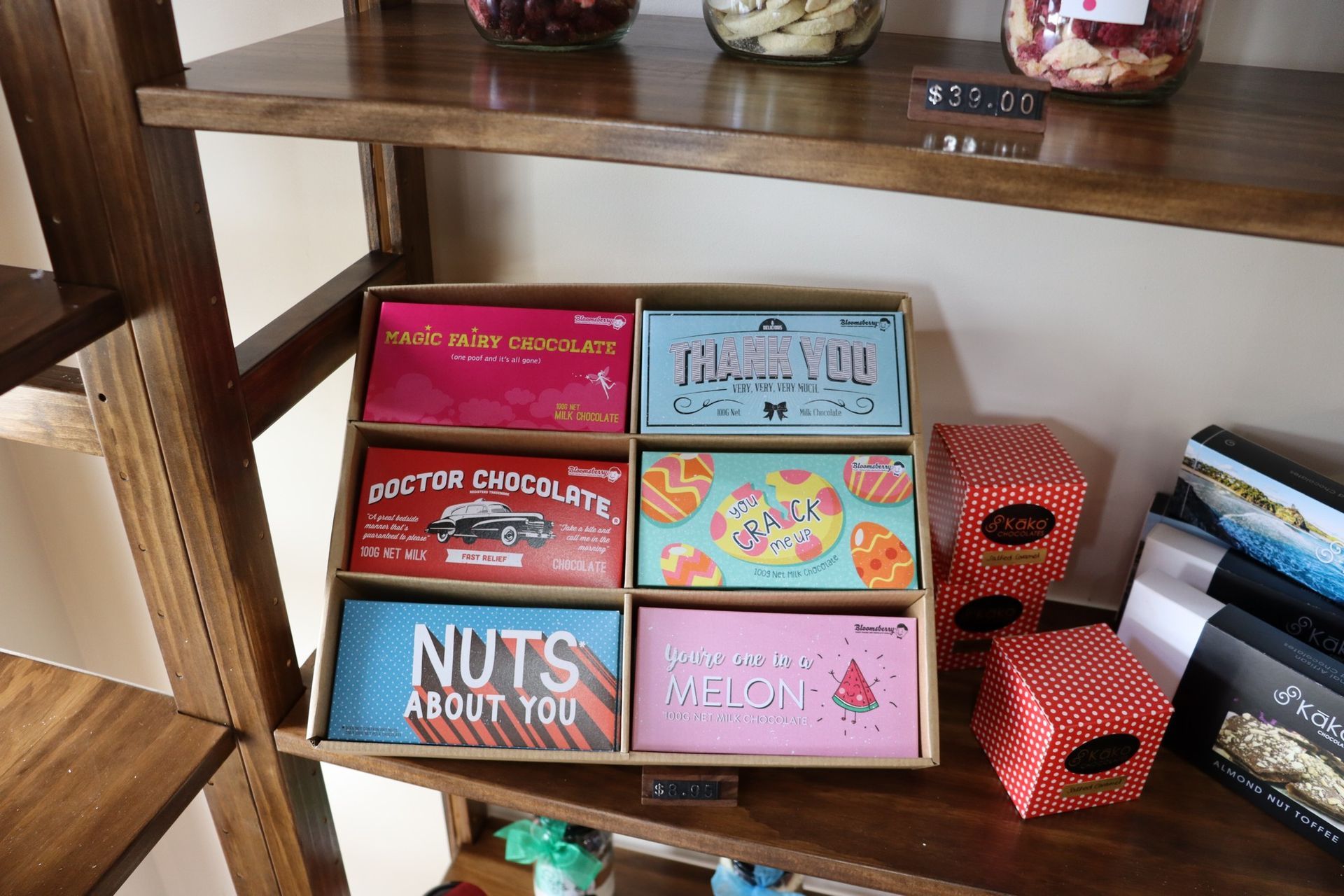 A wooden shelf with boxes of nuts about you on it