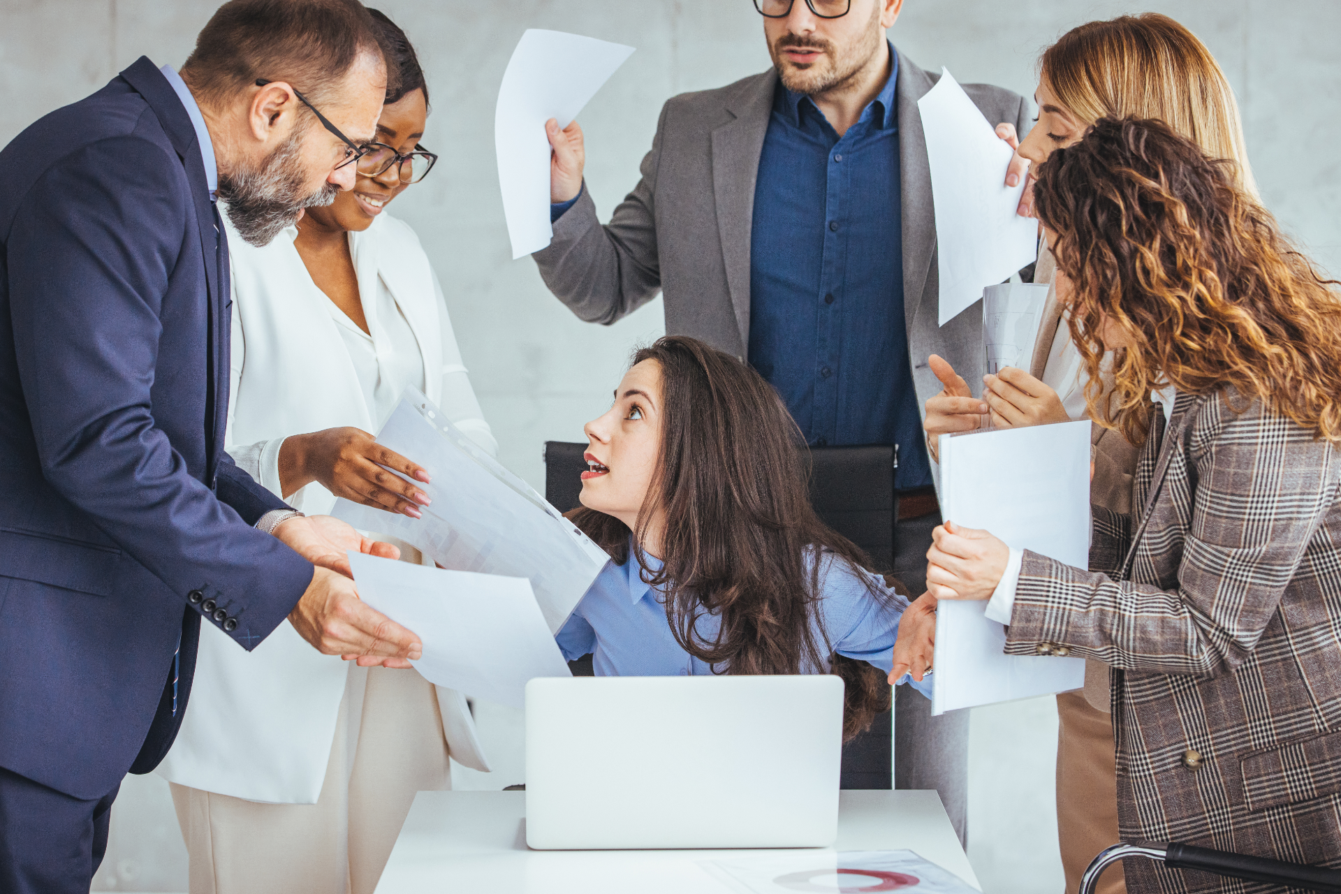 Semi-truck and trailer crashed off road. People stand near wreckage, green field, blue sky.