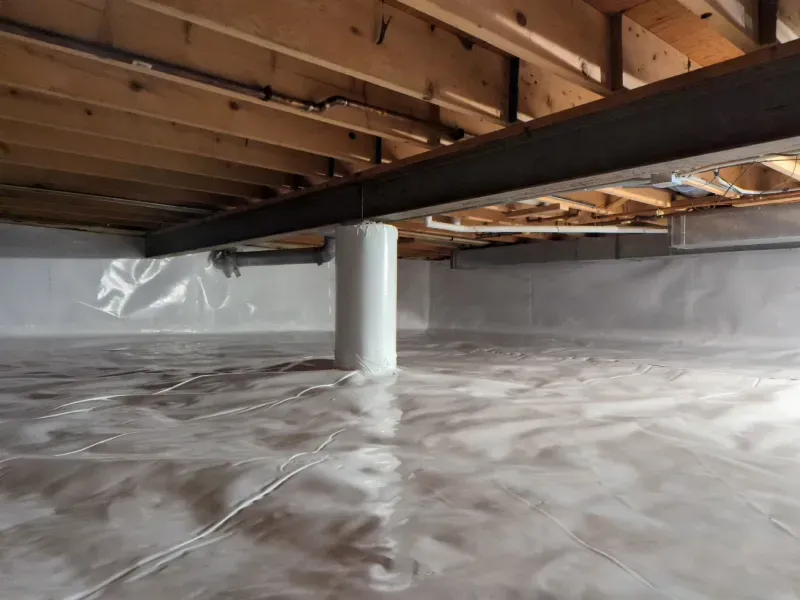 A basement filled with plastic and wooden beams.